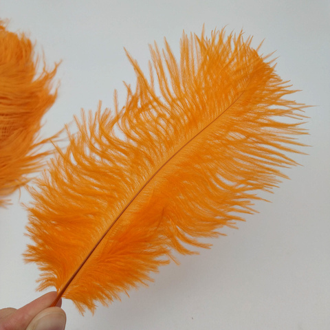 Перья страуса  декоративные  20-25 см. 50 шт. оранжевый