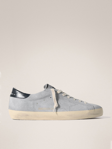 Men's Super Strar in light blue suede with a blue insert on the heel and a perforated star