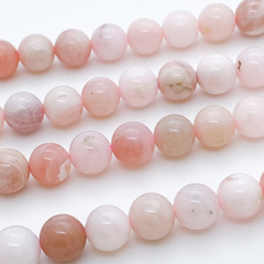 Опал розовый бусины, диаметр 7,8-8 мм, цена за 12 шт (1/4 нити)