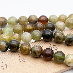 Гранат зеленый бусины, диаметр около 6,5-6,9 мм, цена за 14 шт (1/4 нити)