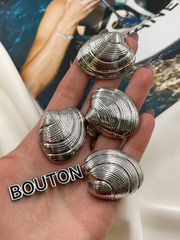 Пуговицы в форме ракушки серебристые