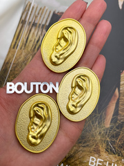 Пуговицы Скиапар. овальные рельефные матовое золото с дизайном 