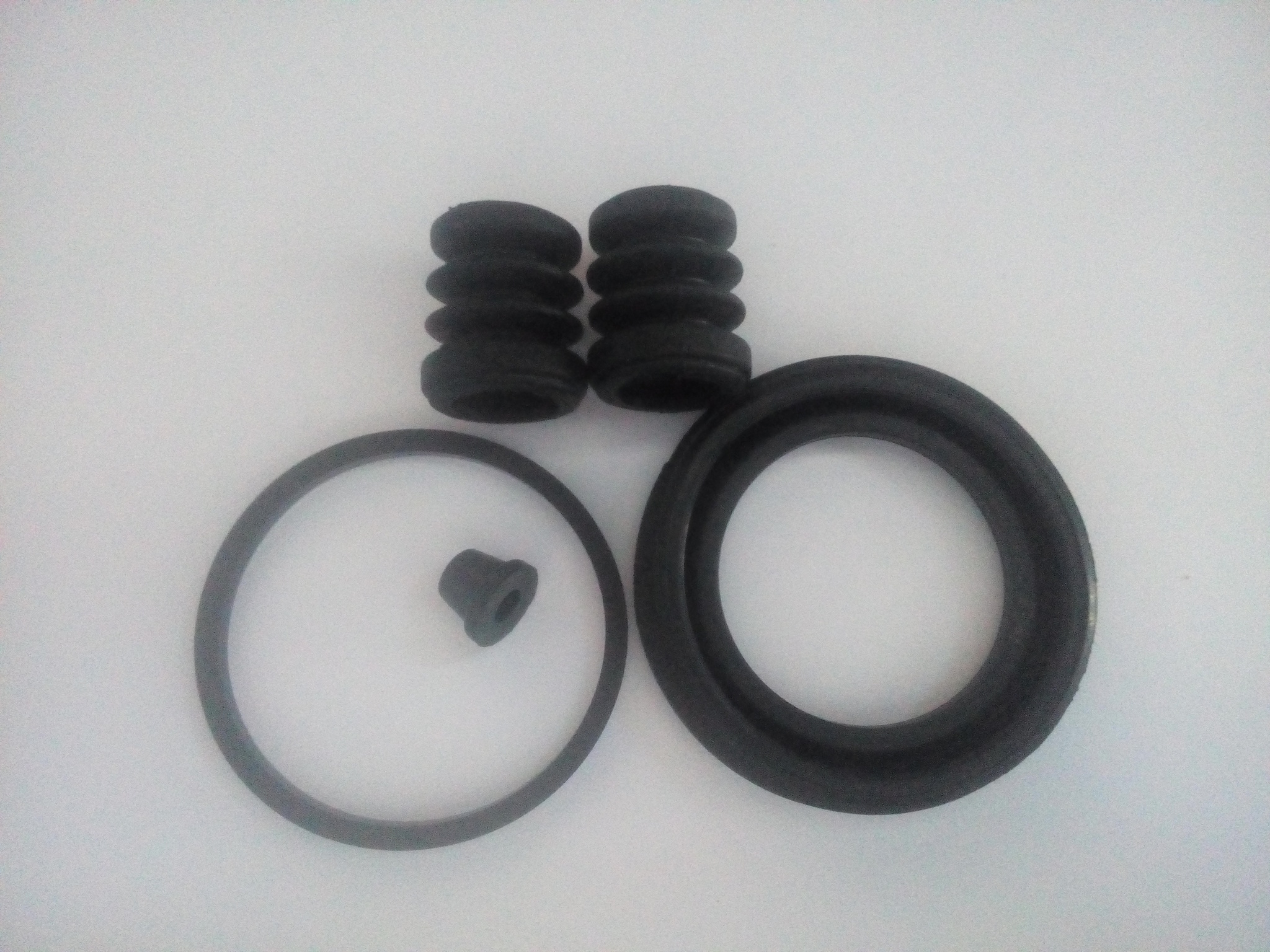 Ремкомплект суппорта 54мм переднего. Ремкомплект заднего суппорта киа спектра 2008 год. Пыльник направляющей суппорта honda dio. Ремкомплект заднего суппорта форд фокус 2. Пыльник тормозного суппорта.