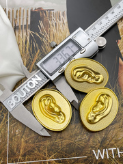 Пуговицы Скиапар. овальные рельефные матовое золото с дизайном 