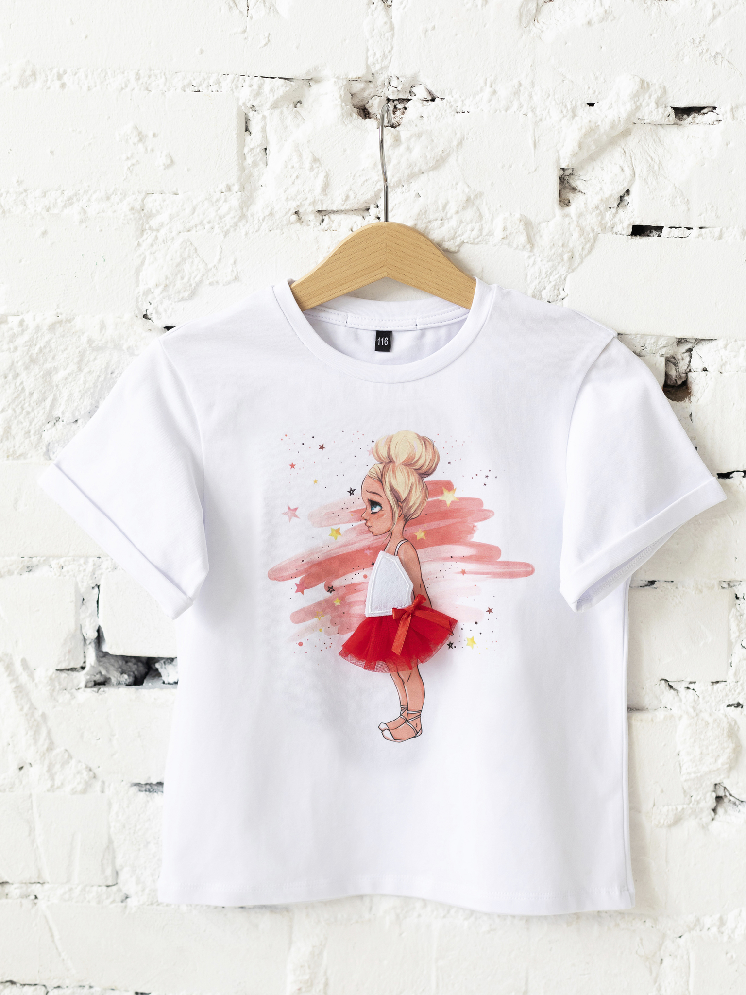 Interactive Ballerina's T-shirt with 2 interchangeable Velcro dresses.
