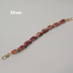 Ручка с фигурными красными бусинами S-68