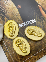 Пуговицы Скиапар. овальные рельефные матовое золото с дизайном 