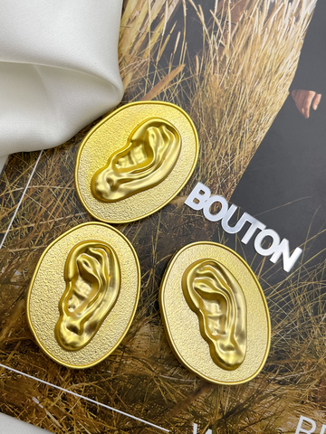 Пуговицы Скиапар. овальные рельефные матовое золото с дизайном 