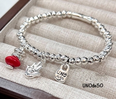 68127- Браслет UNOde 50 с подвесками
