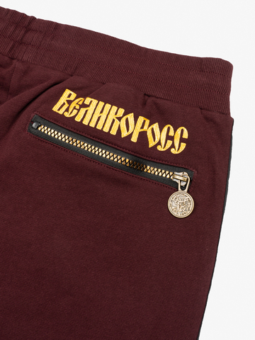 Спортивные штаны цвета красного вина без манжета, без лампасов. Плотный футер