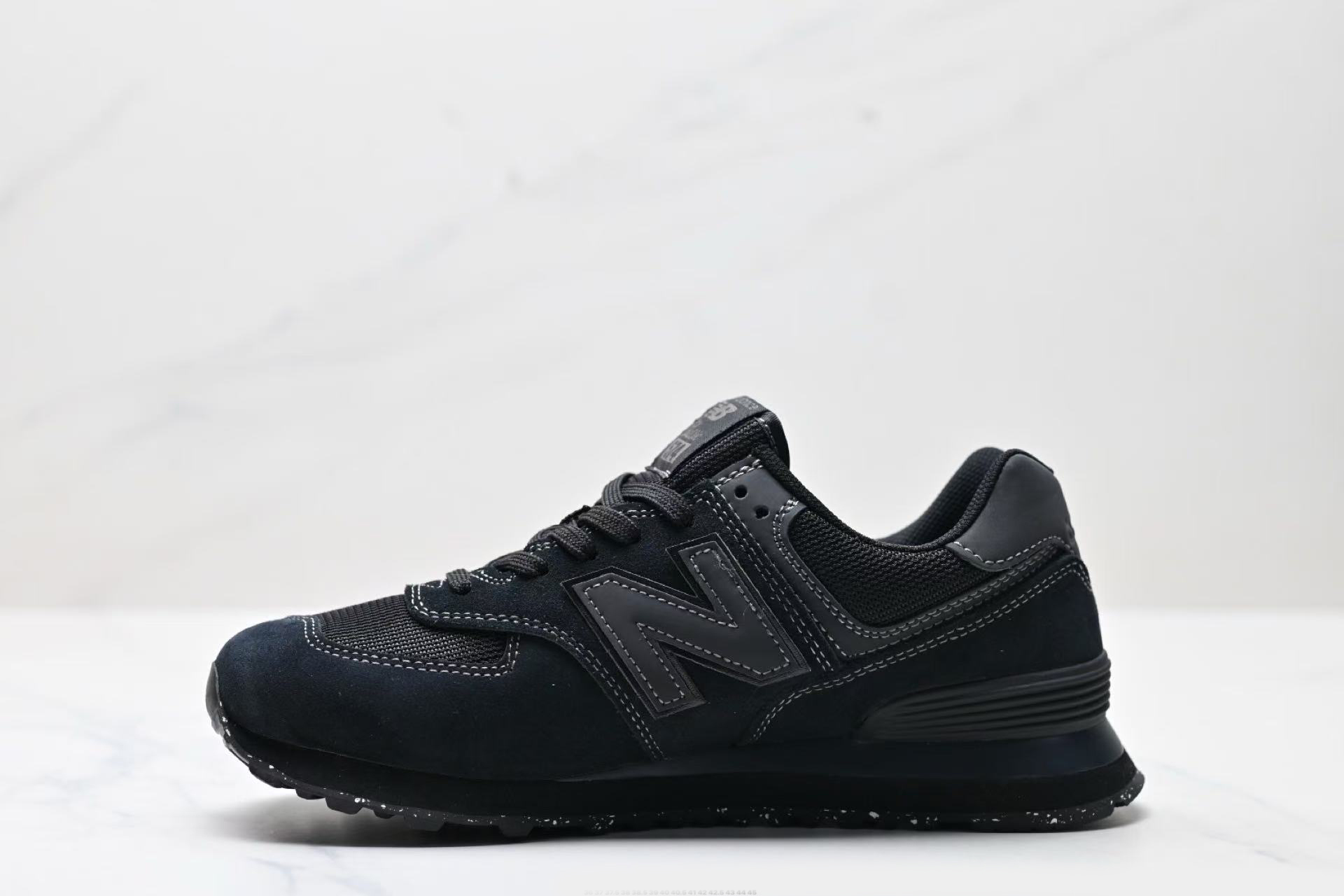 new balance 574 black on black
