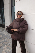 Пуховик средней длины с декором на карманах