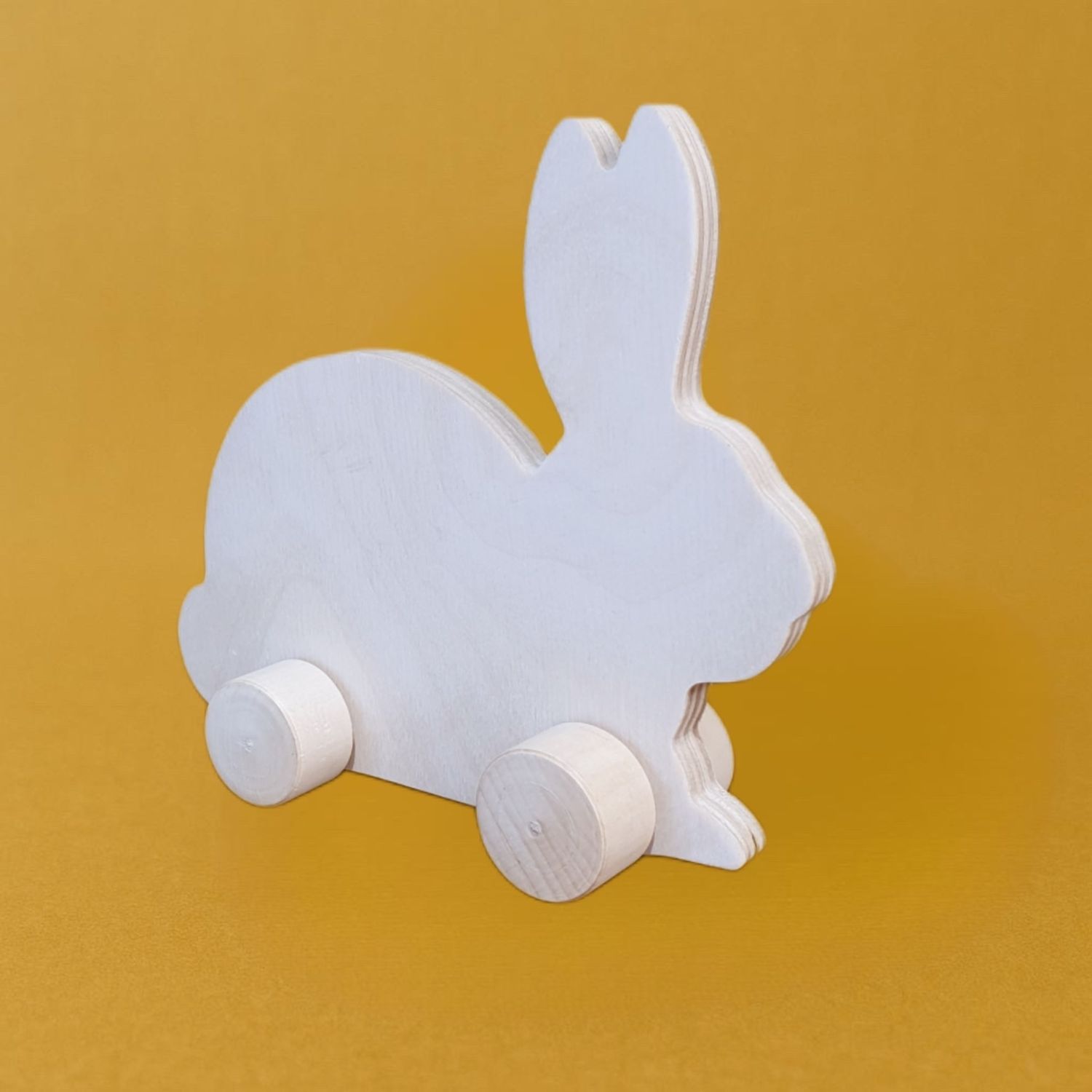 Заяц на колесиках 15х13см.