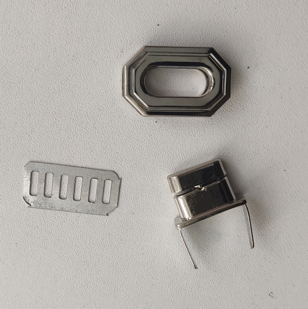 Замок вертушка на винтах 27*17 Серебро