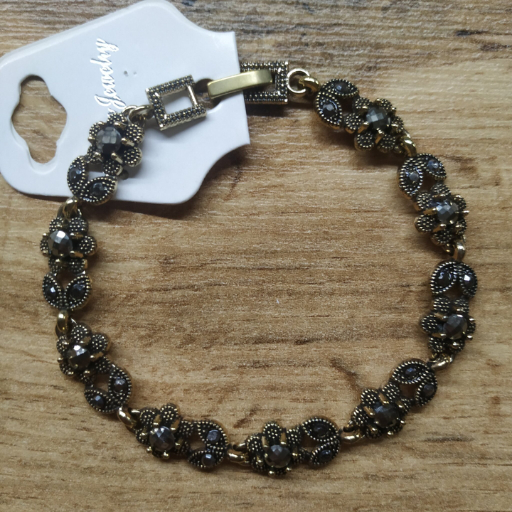 Браслет Венеция шестилистник с лепестками стразы графит металл черненый золотистый