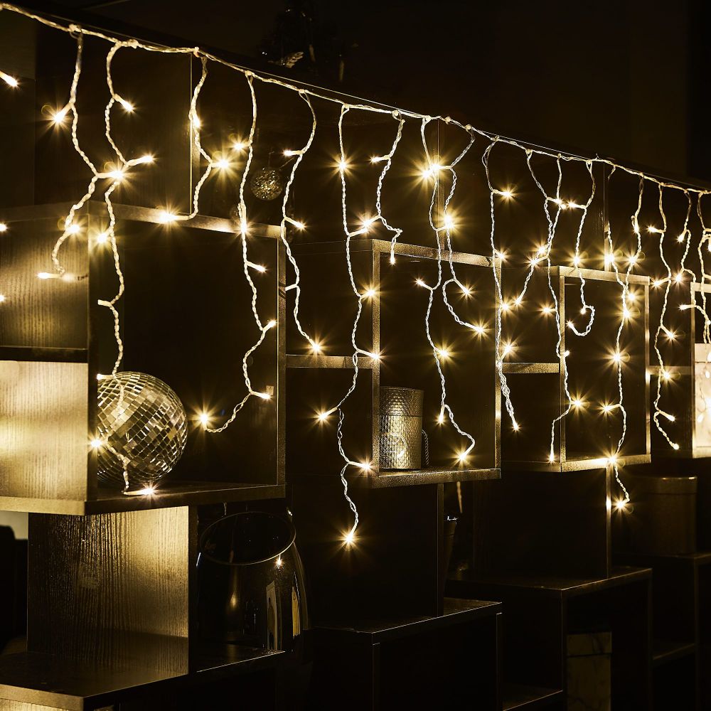 ULD-B6007-200-STK WARM WHITE IP44 Бахрома светодиодная со статическим свечением. 6м. Соединяемая. 200 светодиодов. Теплый белый свет. Провод прозрачный. ТМ Uniel