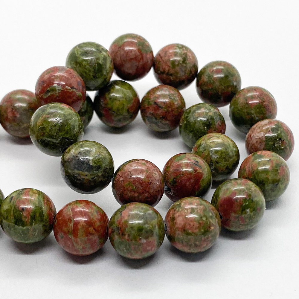 Унакит бусины, диаметр 10,1-10,2 мм, цена за 9 шт (1/4 нити)