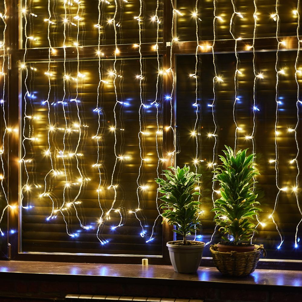 ULD-C2030-240-TTK WARMWHITE-WHITE IP44 Занавес светодиодный с эффектом мерцания. 3х2м. Соединяемый. 240 светодиодов. Теплый белый и белый свет. Провод прозрачный. TM Uniel.