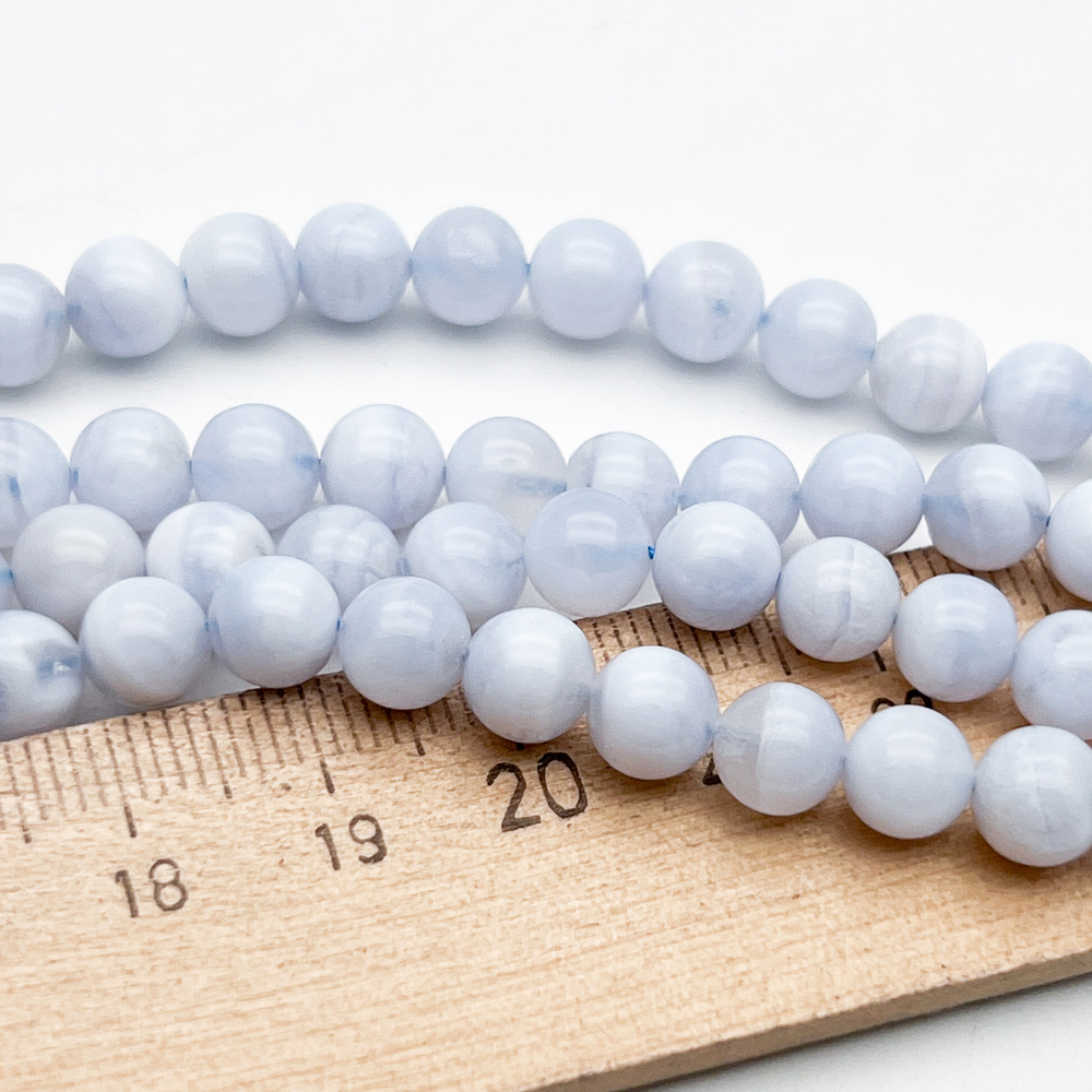 Агат голубой бусины ("Сапфирин"), диаметр около 6,7-6,9 мм, цена за набор 14 шт (1/4 нити)
