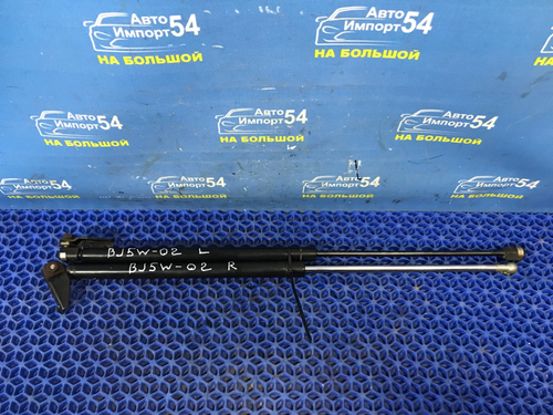 Амортизатор задней двери левый MAZDA FAMILIA 2001