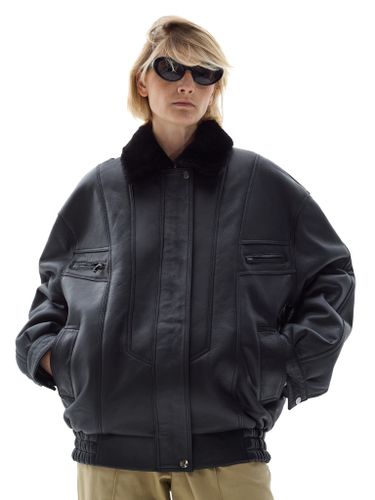 Черная кожаная оверсайз дубленка с отложным воротником