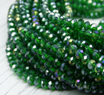 Хрустальные бусины "рондель", комплект из трех цветов: светло-зеленый с AB покрытием, зеленый с AB покрытием, темно-зеленый с AB покрытием, размер: 2х3 мм, общее количество: 290-300 бусин.