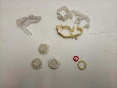 FE925N кт21 Пластиковый крепеж, защёлки и заглушки для стиральной машины Zanussi б/у