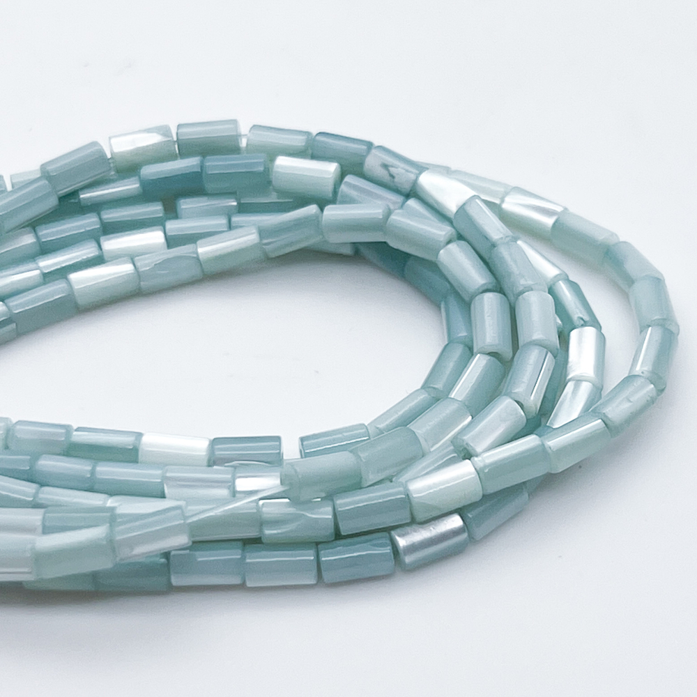 Перламутр тонированный, цвет голубой, размер около 5*2,8 мм, цена за отрезок 36-37 шт (1/2 нити)