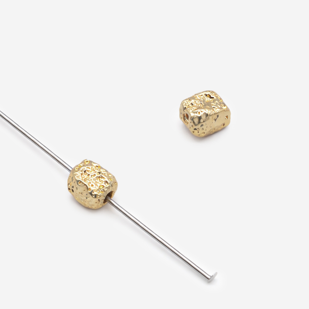 Бусина-разделитель в форме камушка 7*5,5мм, светлая позолота