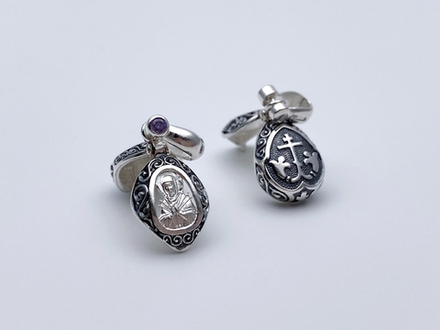 Ладанка из серебра/Чернение/С подвижным ухом/Со вставкой из красных фианитов/Семистрельная