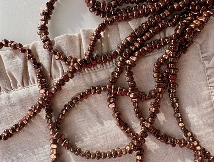 Нить гематитовых бусин, 7-9мм, галтовка