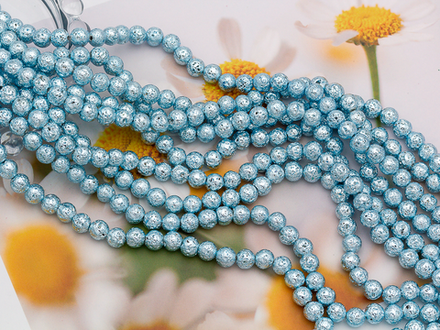 Нить бусин из лавы с покрытием Голубой металлик 6,5-7мм