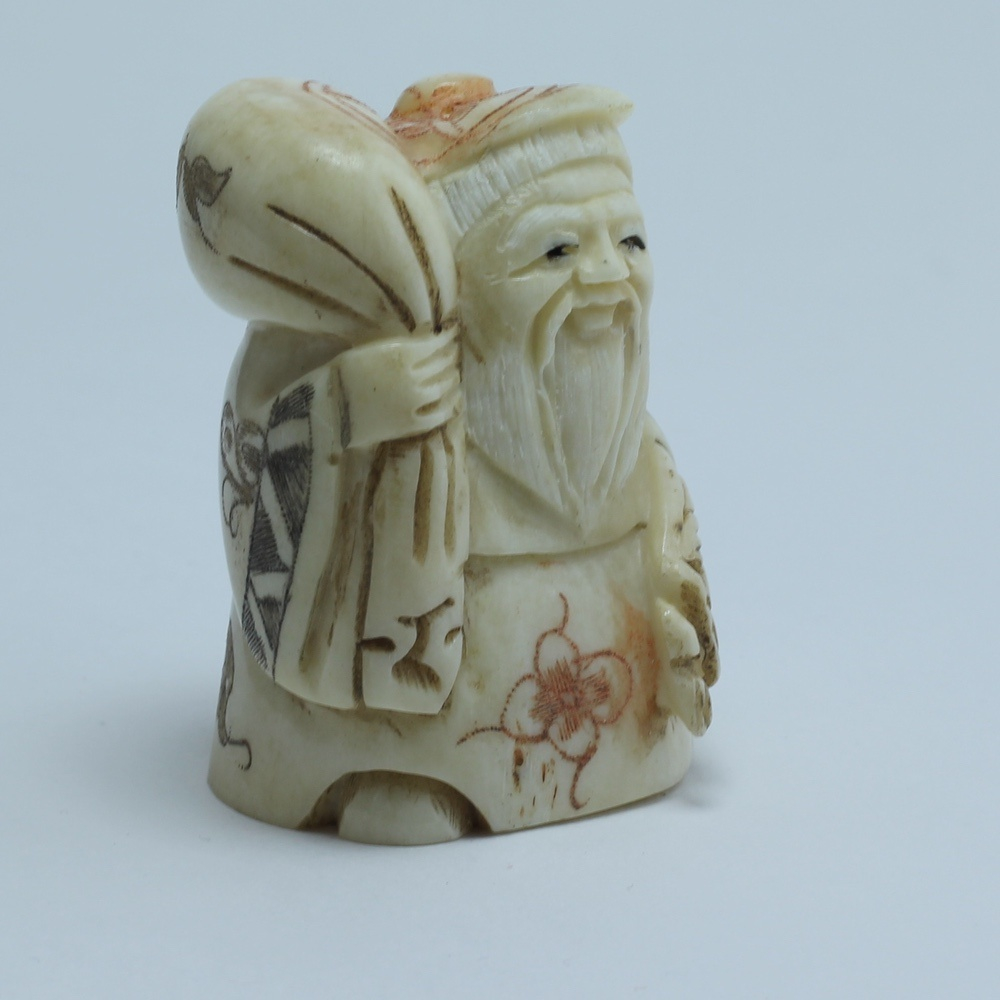 Нэцкэ Дзюродзин с мешком риса и веером