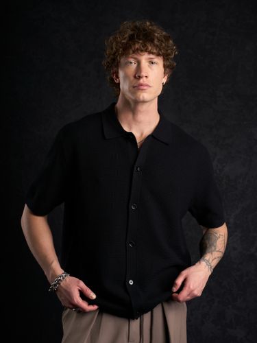 Черная трикотажная рубашка Laine с коротким рукавом