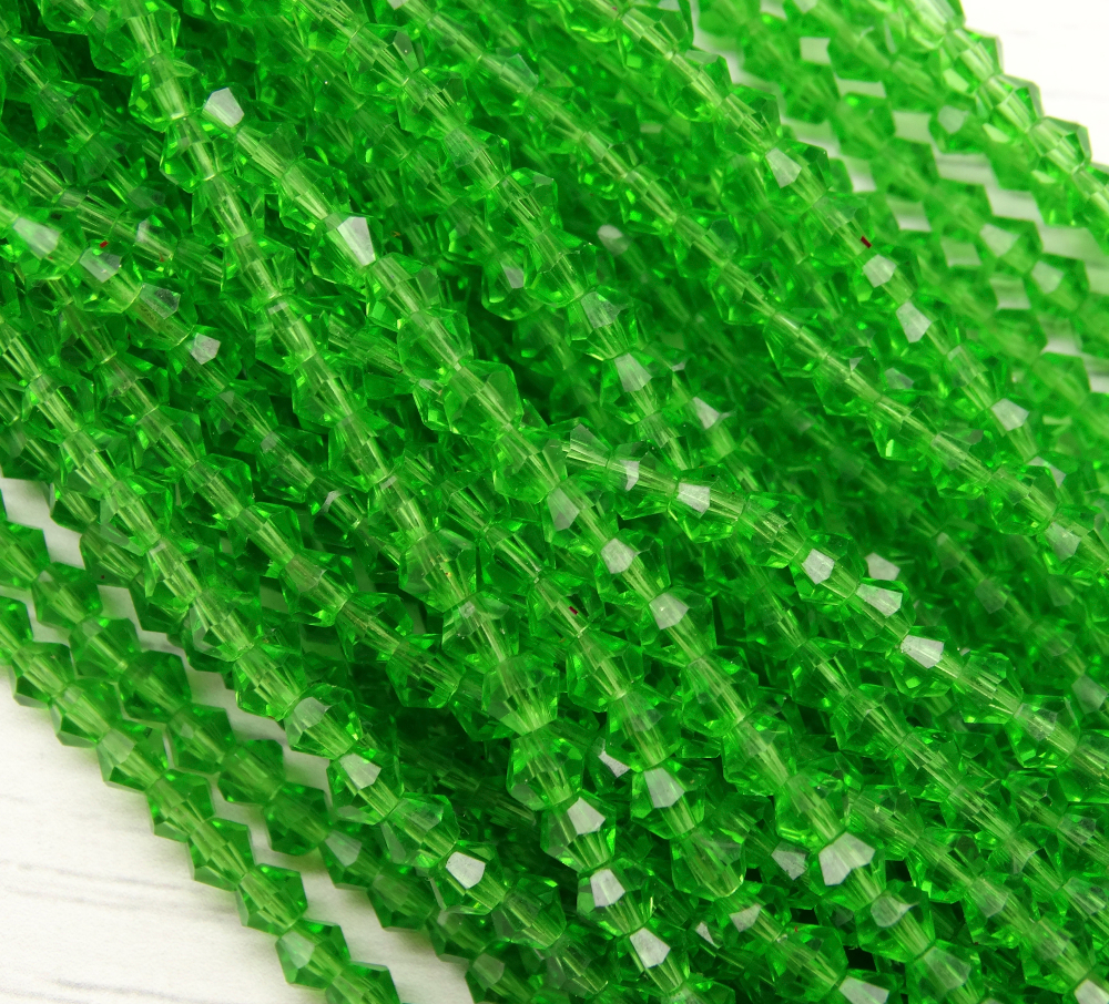 ББ021НН4 Хрустальные бусины "биконус", цвет: зеленый прозрачный, размер 4 мм, кол-во: 95-100 шт.