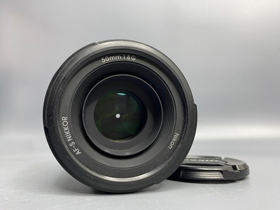 Nikon 50mm 1.8G пылинки
