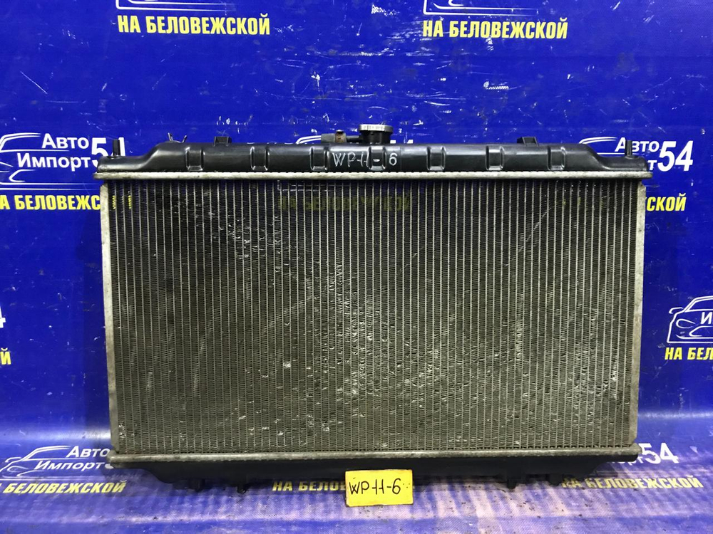 Радиатор двигателя NISSAN PRIMERA 1997