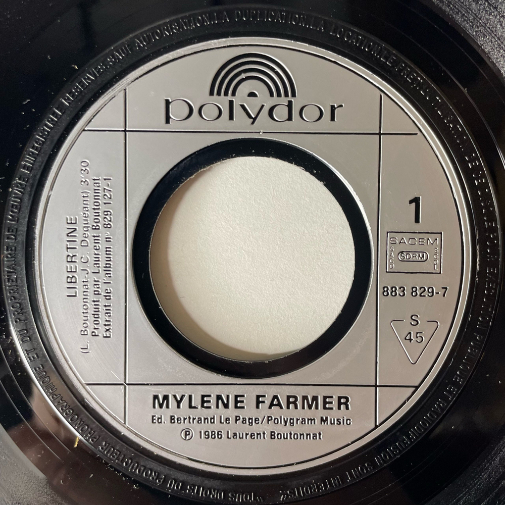 Винтажная виниловая пластинка 7 дюймов (маленькая пластинка) Mylene Farmer Libertine (Франция 1986)