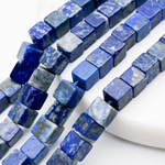 Лазурит бусины, куб, размер около 6-6,5 мм, цена за 15 шт (1/4 нити)
