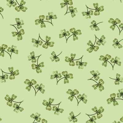 Листочки клевера на светло-зеленом