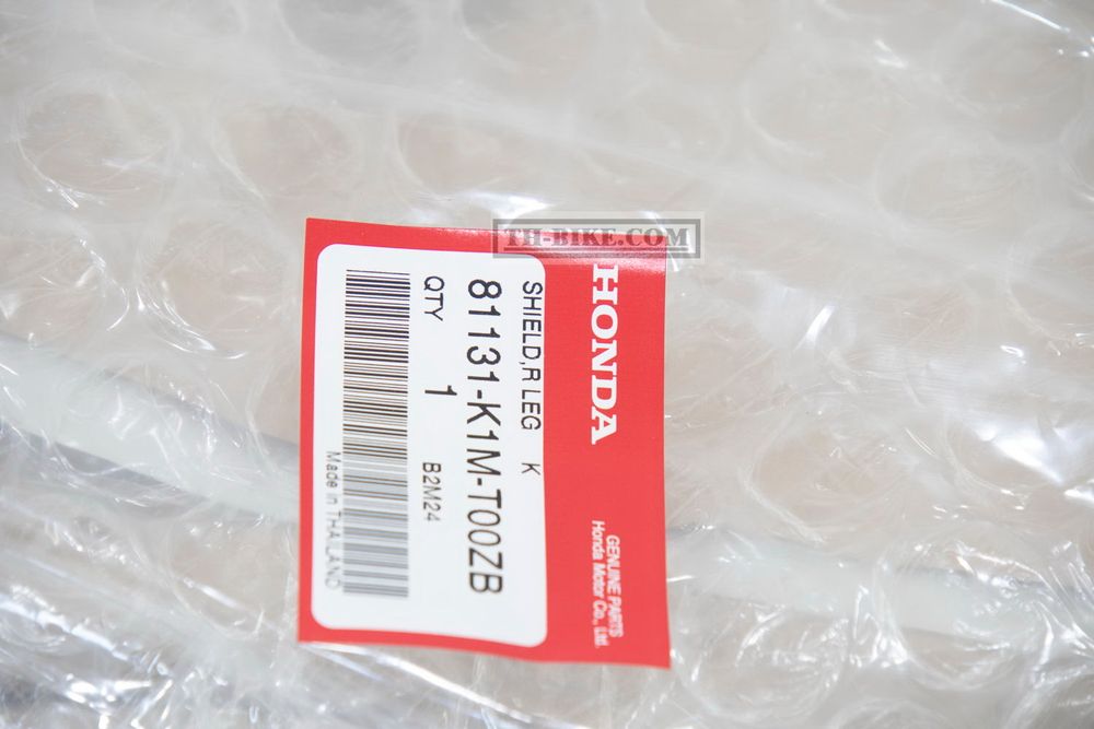 81131-K1M-T00ZB. SHIELD, R. LEG *NHC13P*. HONDA