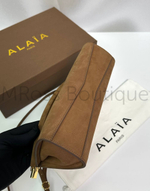 Женская сумка Alaia Le Click East West коричневого цвета замшевая