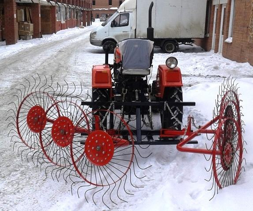 Грабли-ворошилки колёсно-пальцевые двухкрылые