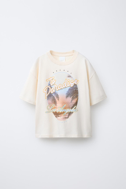 ZARA ФУТБОЛКА С ПРИНТОМ «ФЕСТИВАЛЬ» СО СТРАЗАМИ, ЭКРЮ