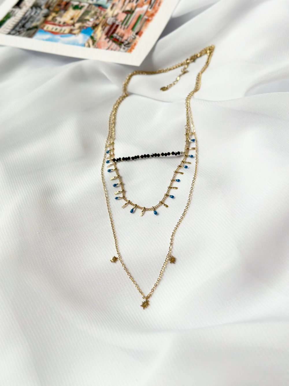 Многослойное колье:черная шпинель, голубая эмаль, три солнца, золото