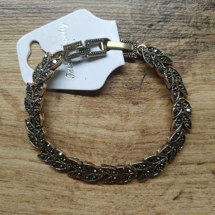 Браслет Венеция листья стразы графит металл черненый золотистый