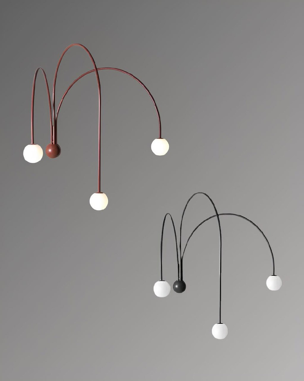 Стильное настенное бра с изящными дугообразными держателями и матовыми шарообразными плафонами.