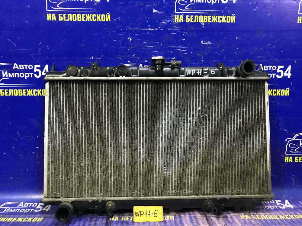 Радиатор двигателя NISSAN PRIMERA 1997