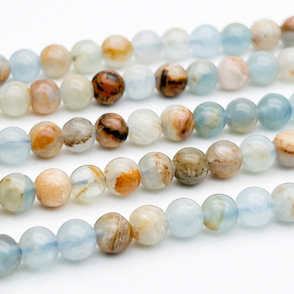 Кальцит голубой бусины, диаметр около 5,7-5,9 мм, цена за 17-18 шт (1/4 нити)