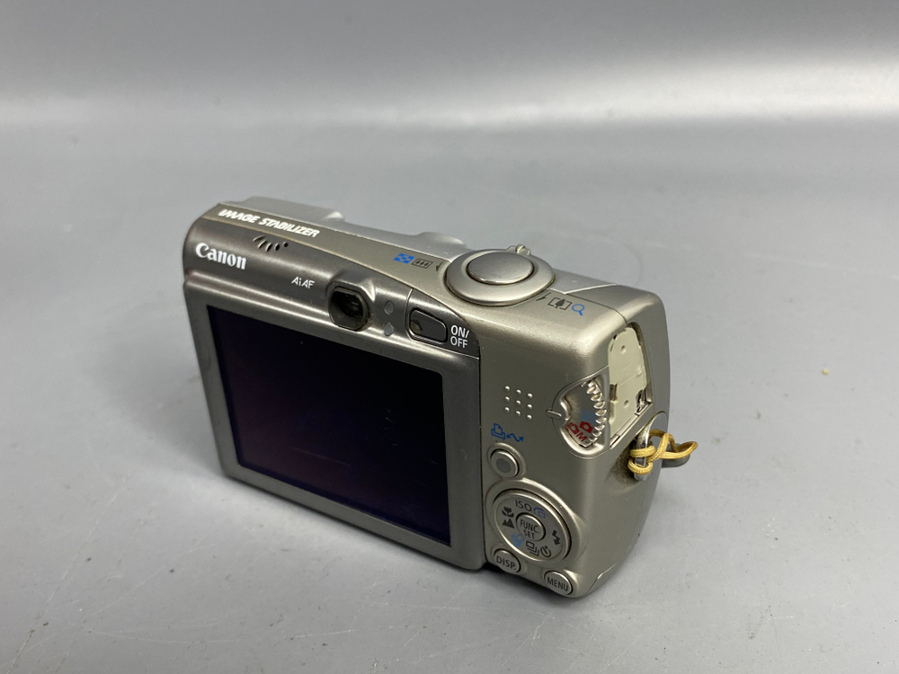 Canon Digital IXUS 950 IS, объектив шумит